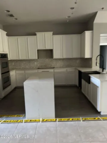 a room with a window and a cabinet