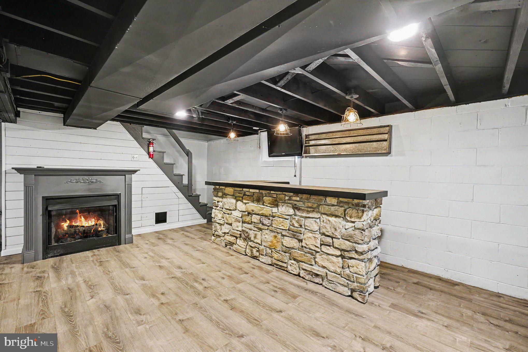 201 Mountain Road Fallston, MD 21047 - Photo 25 of 35 a view of an empty room with wooden floor a fireplace