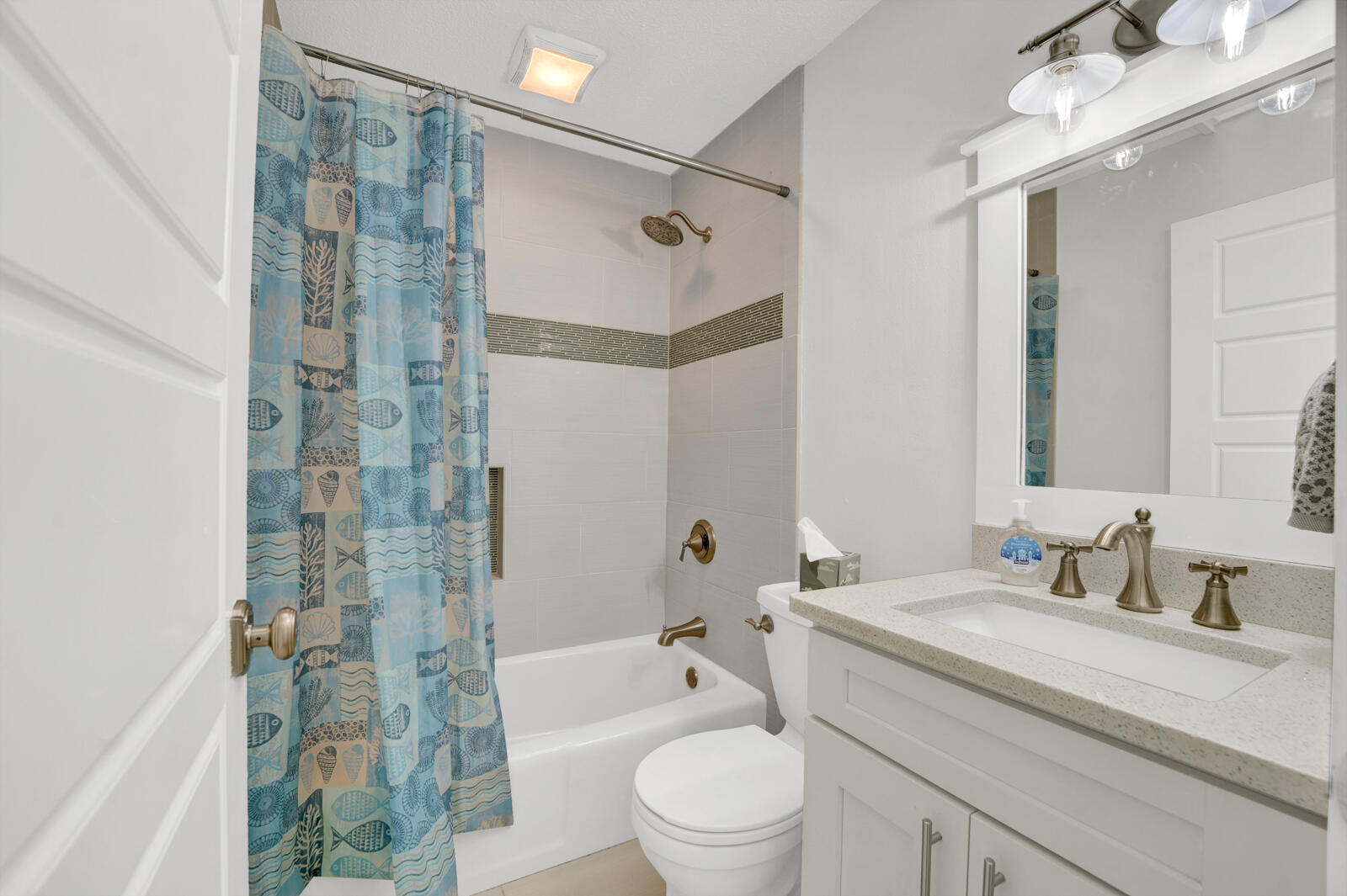 1020 Bay Grove Road Freeport, FL 32439 - Photo 27 of 71 a bathroom with a granite countertop sink a toilet and shower