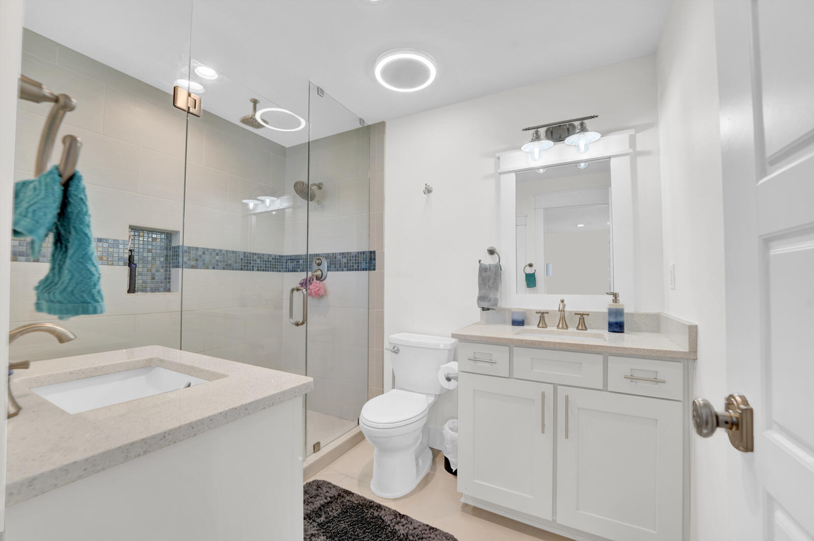 1020 Bay Grove Road Freeport, FL 32439 - Photo 37 of 71 a bathroom with a sink a toilet and mirror