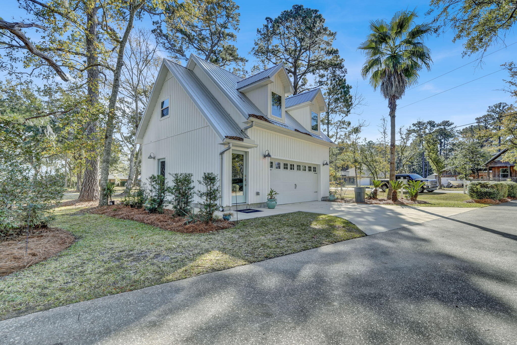 1020 Bay Grove Road Freeport, FL 32439 - Photo 40 of 71 a view of a house with a yard and garage