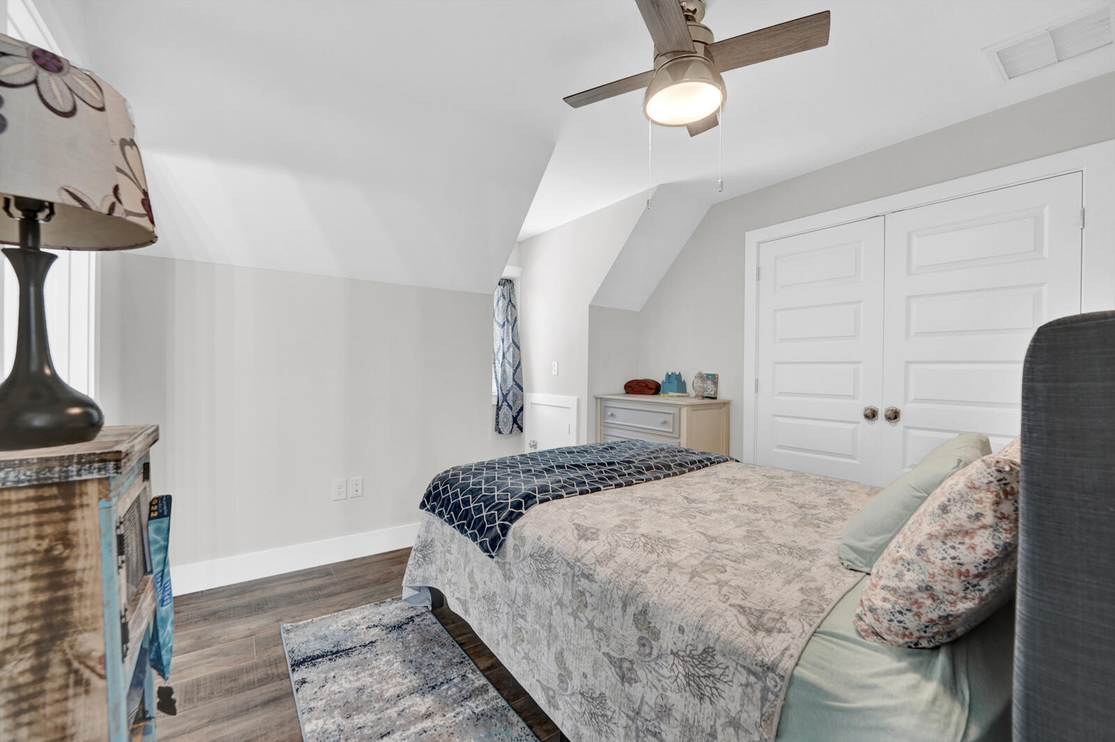 1020 Bay Grove Road Freeport, FL 32439 - Photo 49 of 71 a bedroom with a bed and a chandelier