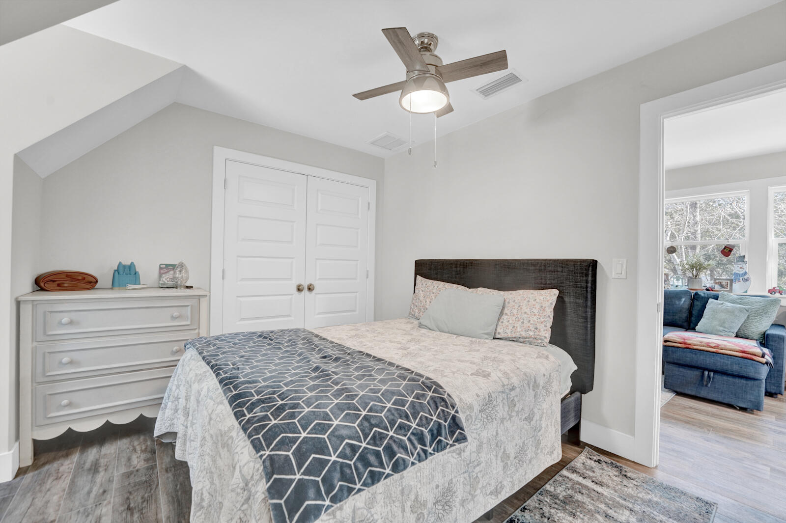 1020 Bay Grove Road Freeport, FL 32439 - Photo 50 of 71 a bedroom with a large bed and a chandelier