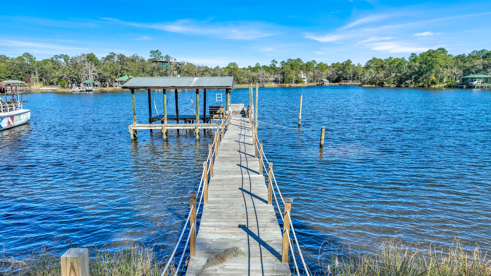 1020 Bay Grove Road Freeport, FL 32439 - Photo 58 of 71 a view of a patio with wooden floor and lake view
