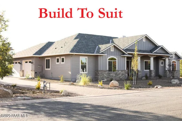 a front view of a house with a garage