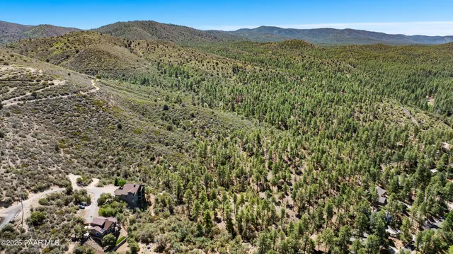 a view of an mountain with a mountain in the background