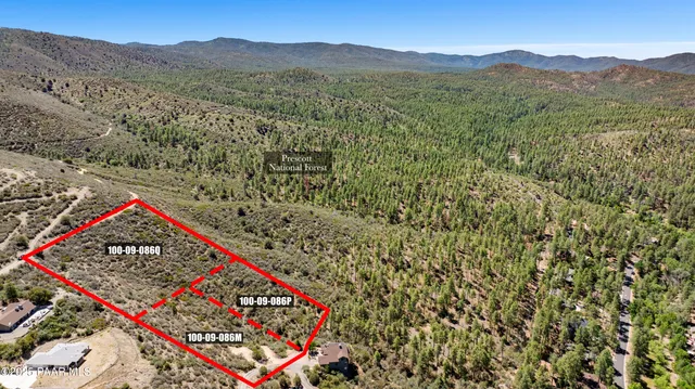 a view of a mountain with a mountain in the background