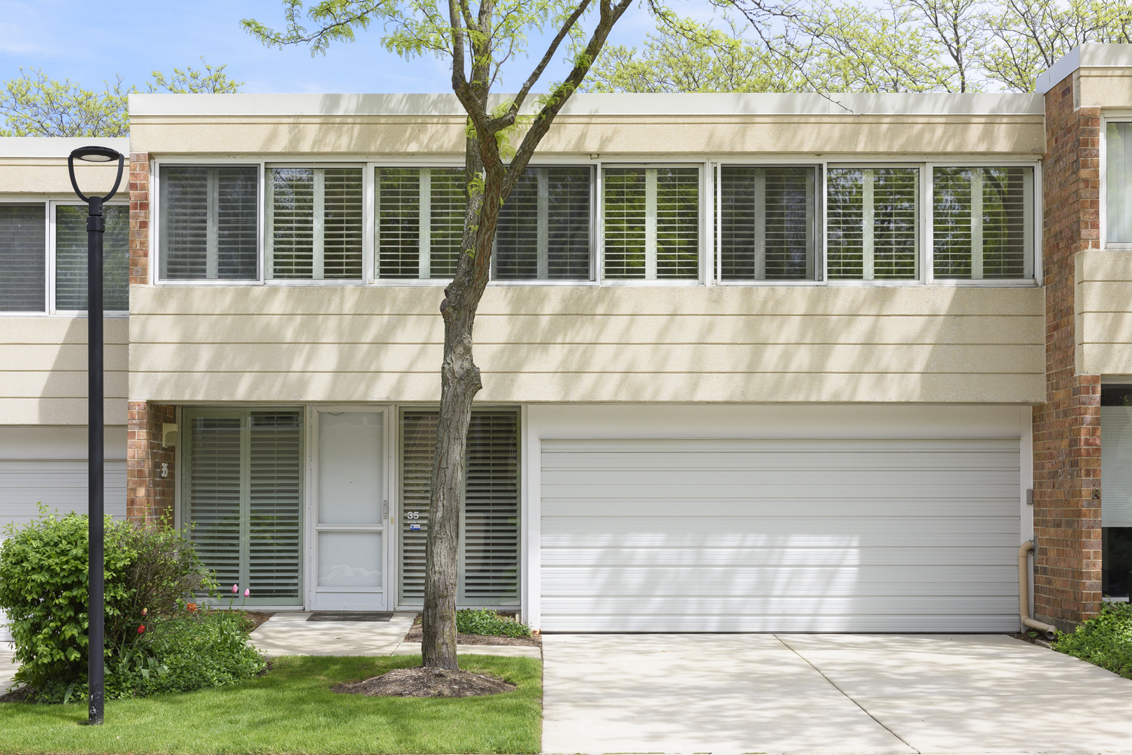 35 Avon Road Northbrook, IL 60062 - Photo 1 of 12 a front view of a house with a yard