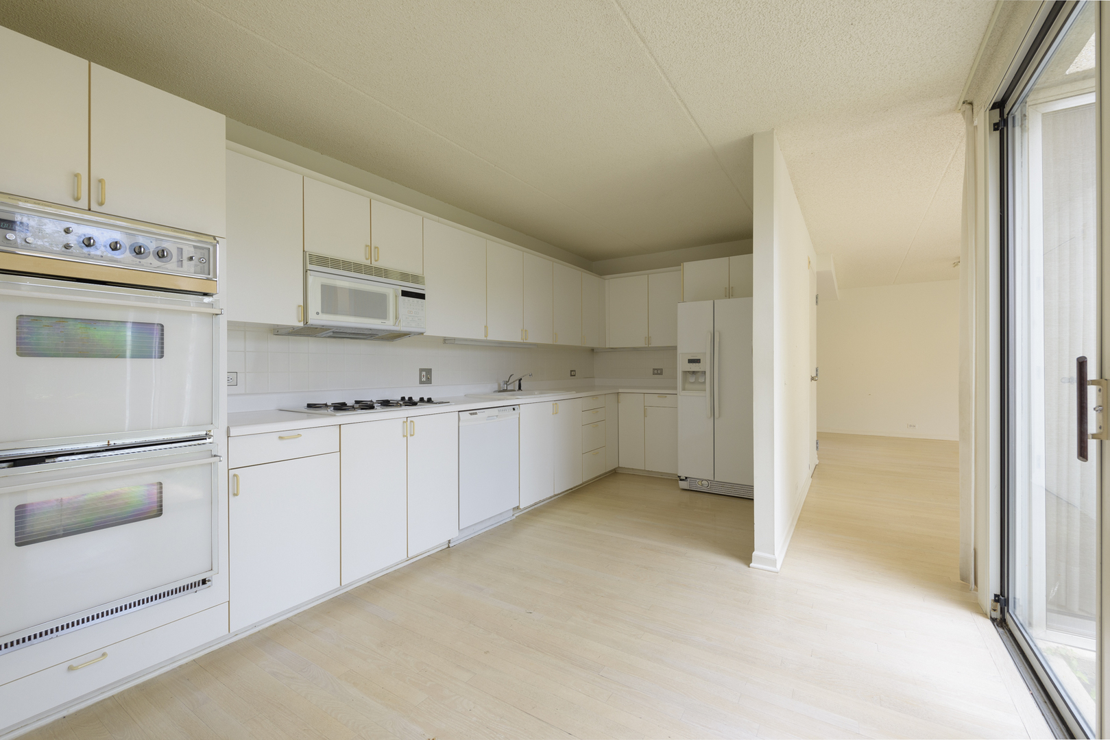 35 Avon Road Northbrook, IL 60062 - Photo 3 of 12 a view of a kitchen with white cabinets