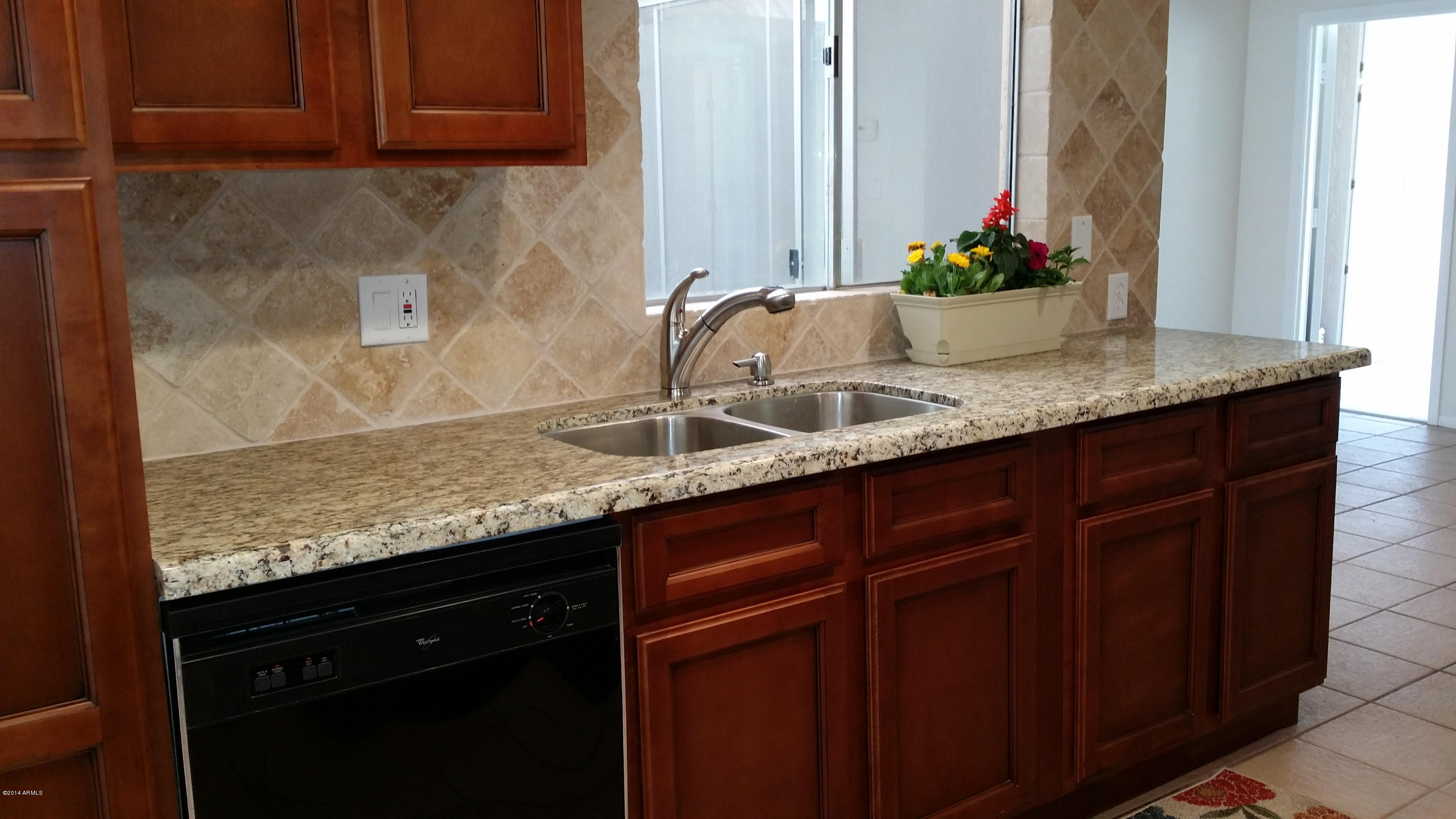 11624 South Ki Road Phoenix, AZ 85044 - Photo 2 of 19 Ki kitchen looks out to atrium