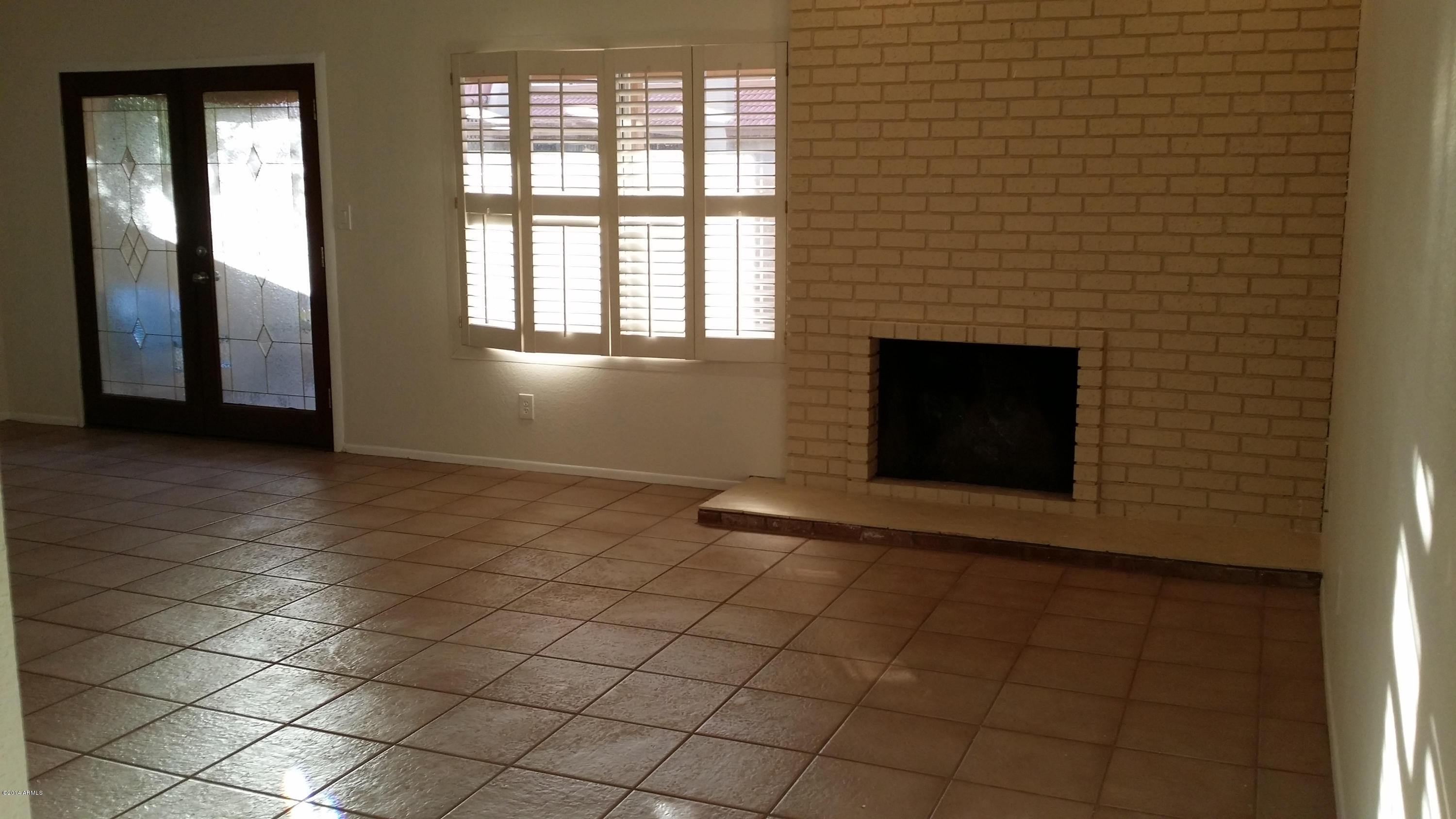 11624 South Ki Road Phoenix, AZ 85044 - Photo 9 of 19 Ki family room with cozy fire place