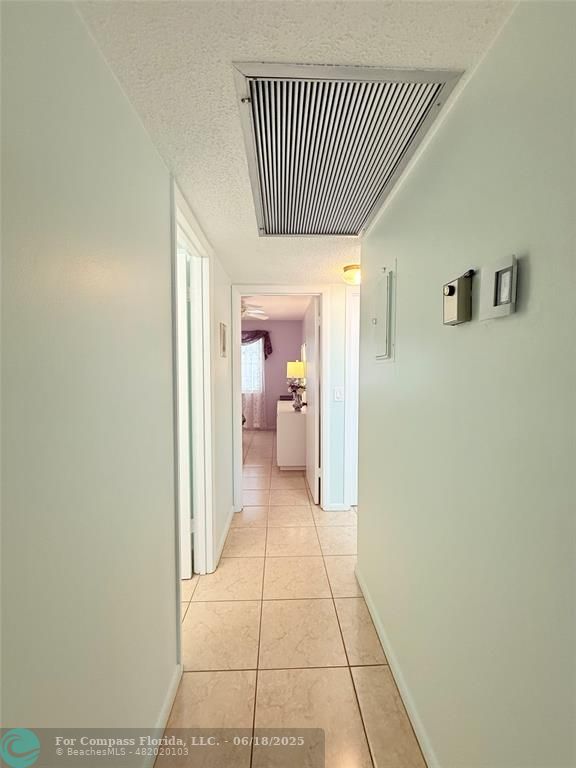 15 Markham A, Unit 15 Deerfield Beach, FL 33442 - Photo 17 of 45 a view of a hallway with a livingroom and a bathroom