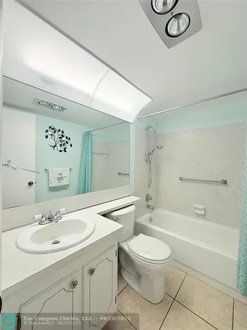 a bathroom with a sink toilet a mirror and shower