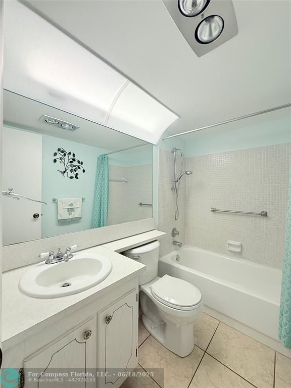 15 Markham A, Unit 15 Deerfield Beach, FL 33442 - Photo 18 of 45 a bathroom with a sink toilet a mirror and shower