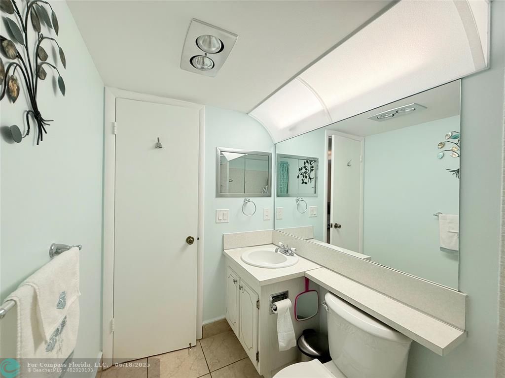 15 Markham A, Unit 15 Deerfield Beach, FL 33442 - Photo 19 of 45 a bathroom with a sink a toilet and shower