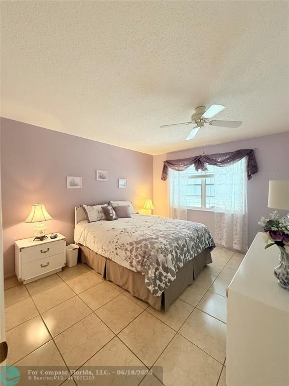 15 Markham A, Unit 15 Deerfield Beach, FL 33442 - Photo 21 of 45 a spacious bedroom with a bed and window