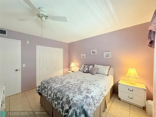 a bedroom with a bed and a closet