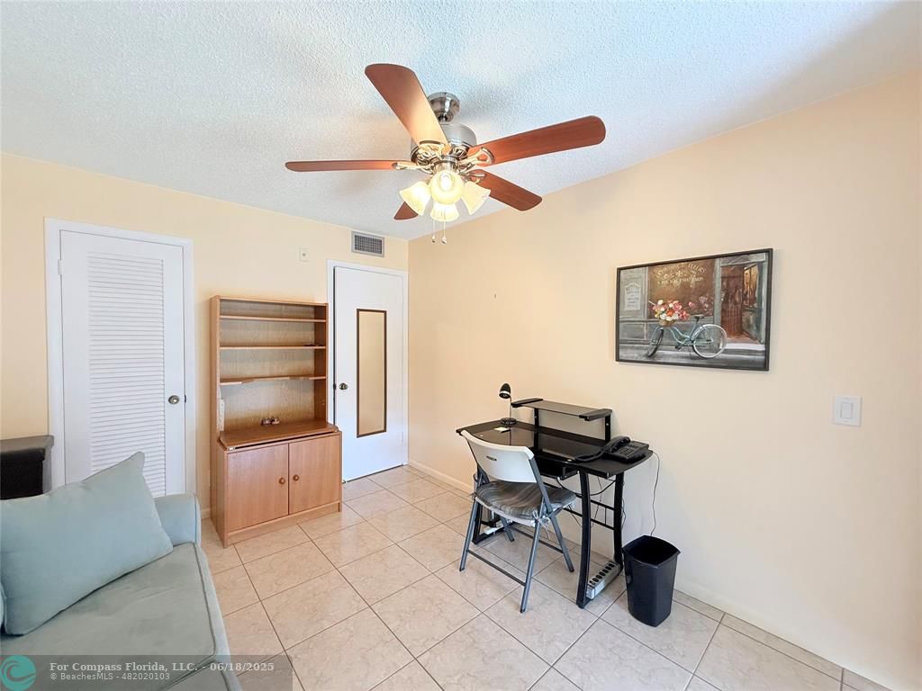 15 Markham A, Unit 15 Deerfield Beach, FL 33442 - Photo 28 of 45 a workspace with furniture and window