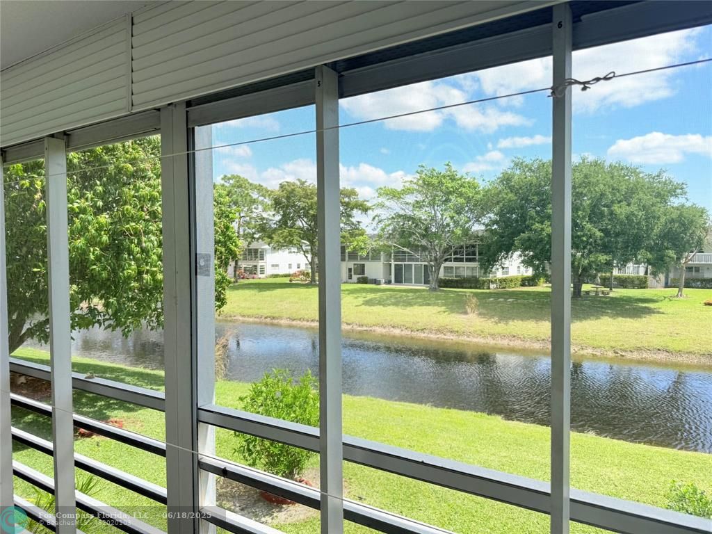 15 Markham A, Unit 15 Deerfield Beach, FL 33442 - Photo 32 of 45 a view of lake from a window