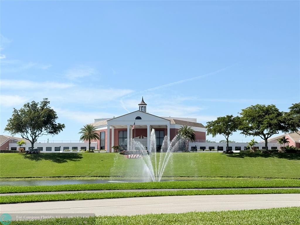 15 Markham A, Unit 15 Deerfield Beach, FL 33442 - Photo 39 of 45 a front view of a house with a yard