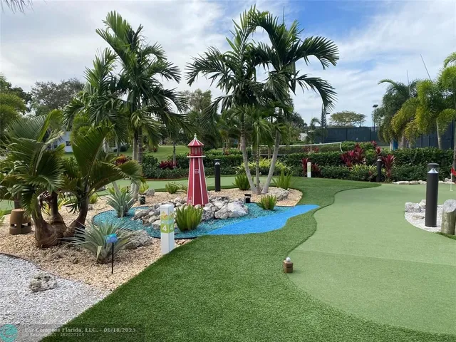 a view of a backyard with swimming pool
