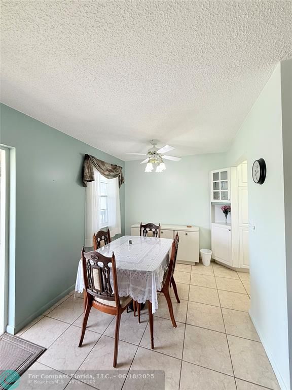 15 Markham A, Unit 15 Deerfield Beach, FL 33442 - Photo 9 of 45 a view of a dining room with furniture
