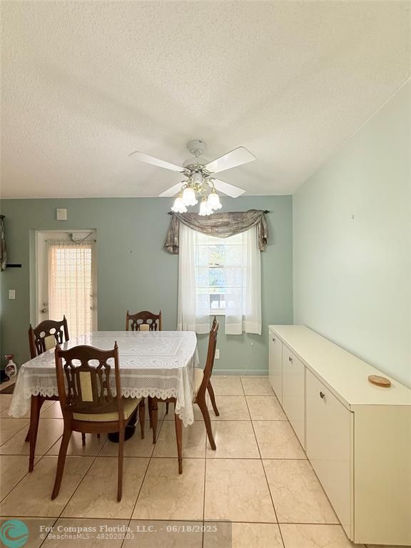15 Markham A, Unit 15 Deerfield Beach, FL 33442 - Photo 10 of 45 a dining room with furniture and window