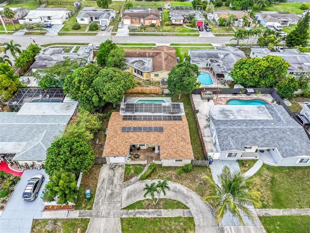 an aerial view of a house with a garden