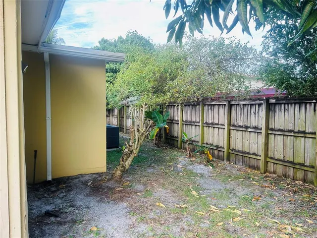 a view of backyard with green space