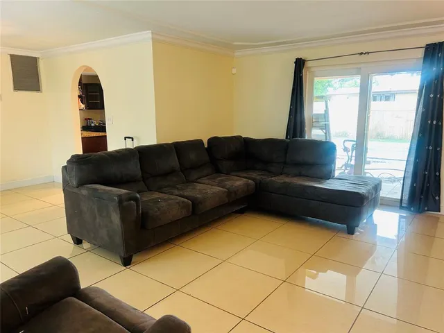 a living room with furniture and a couch