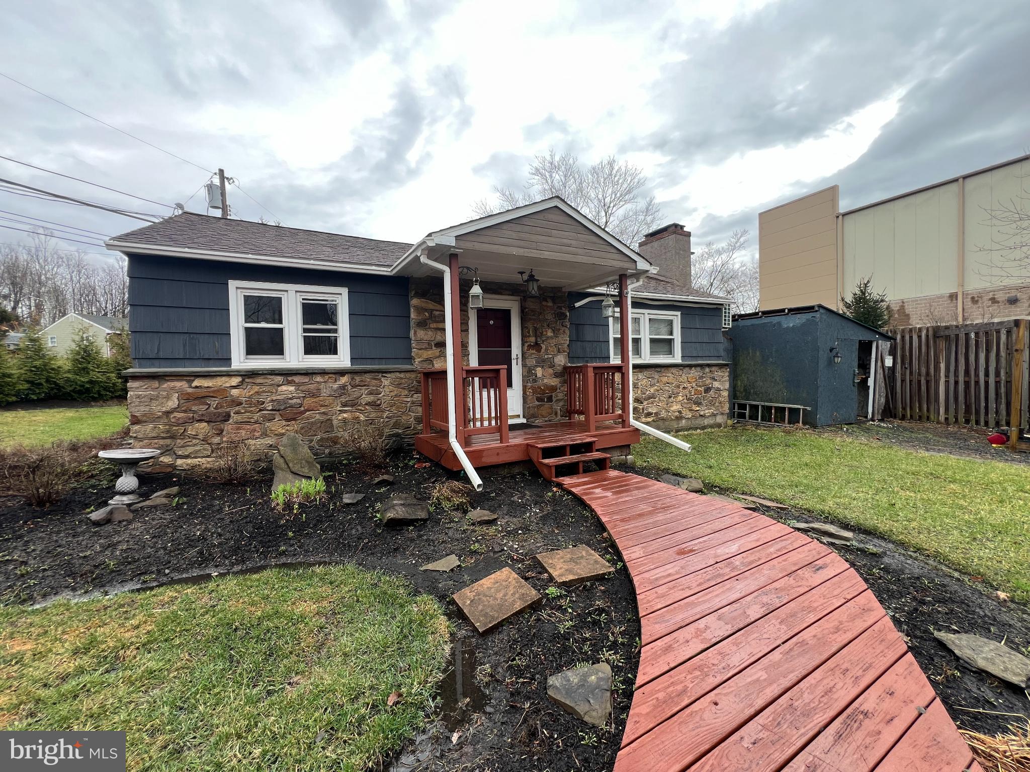 a view of a house with backyard and porch