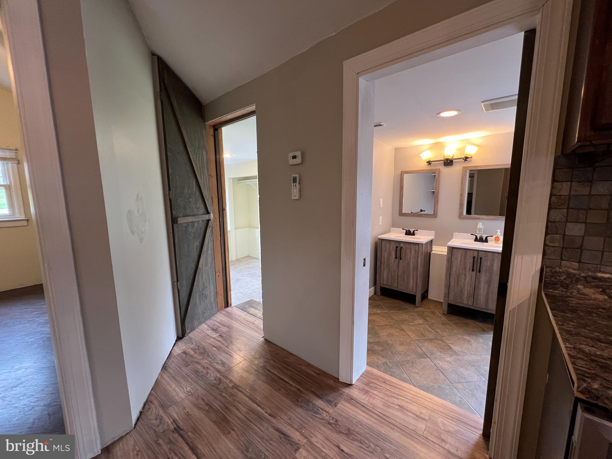 30 Duane Road Doylestown, PA 18901 - Photo 17 of 26 a view of a bathroom from a hallway