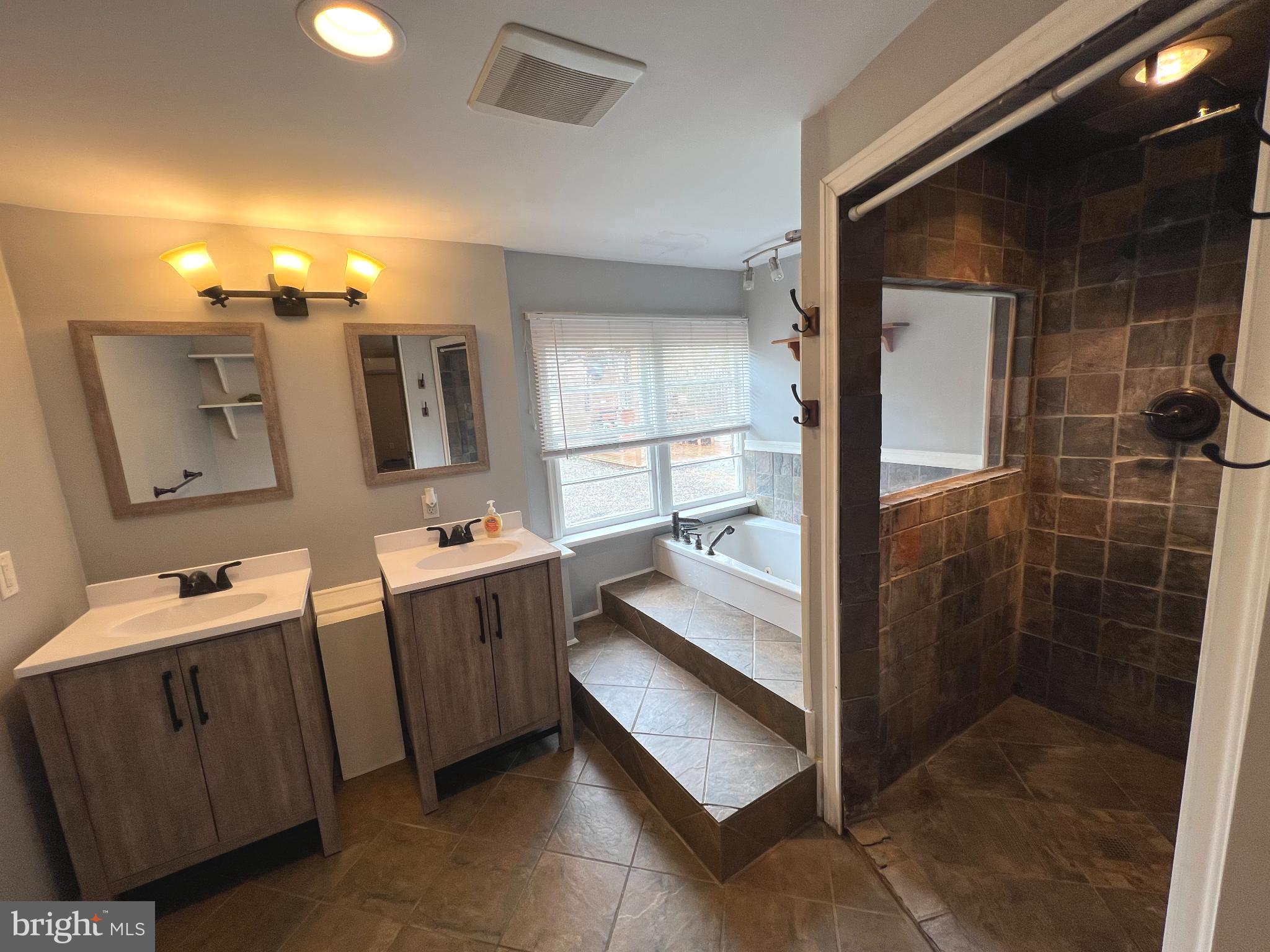 30 Duane Road Doylestown, PA 18901 - Photo 20 of 26 a bathroom with a tub sink and mirror