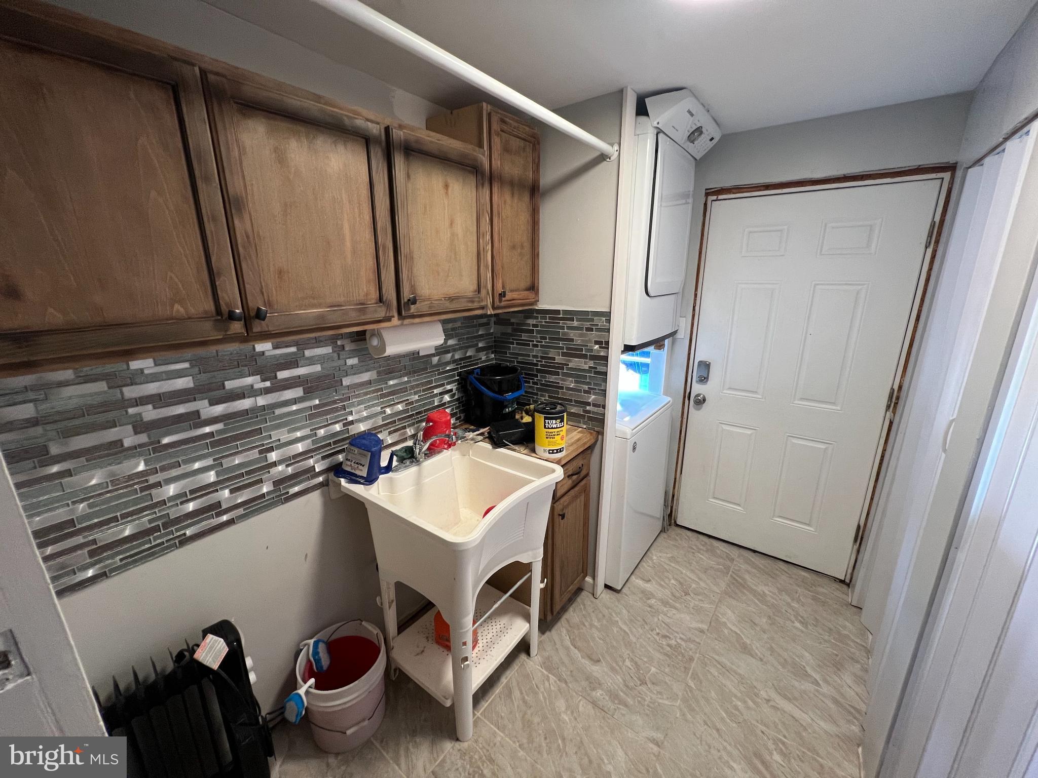 30 Duane Road Doylestown, PA 18901 - Photo 24 of 26 a utility room with a sink a washer and dryer