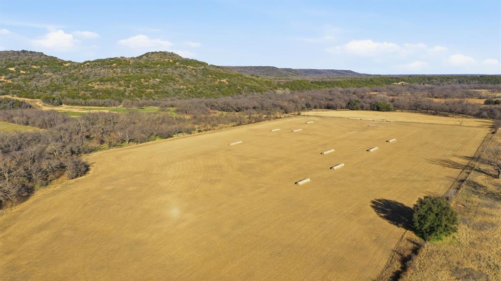 200 Patterson Lane Palo Pinto, TX 76484 - Photo 3 of 24 a view of lake with mountain