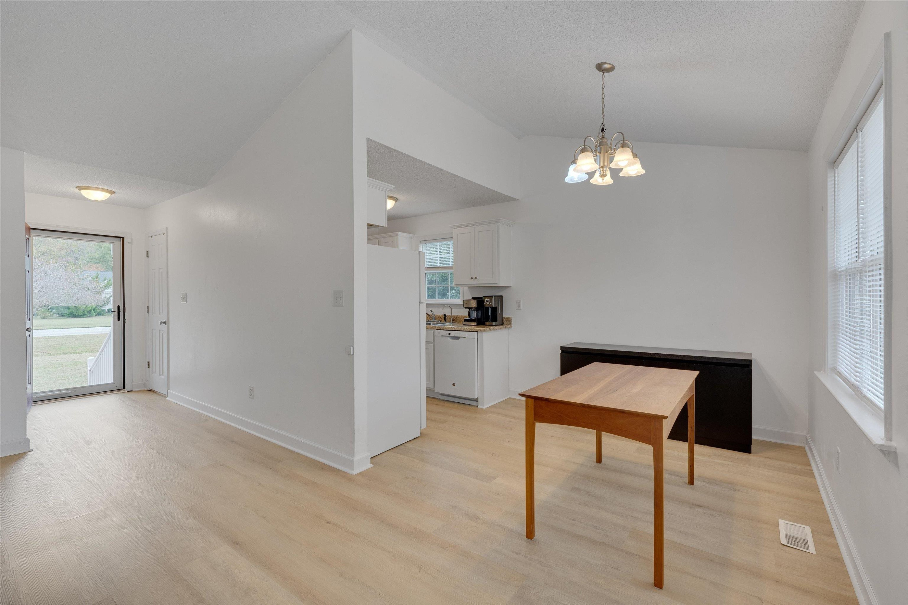 2568 Matthews Road Clayton, NC 27520 - Photo 11 of 26 a view of a room with a furniture wooden floor and windows