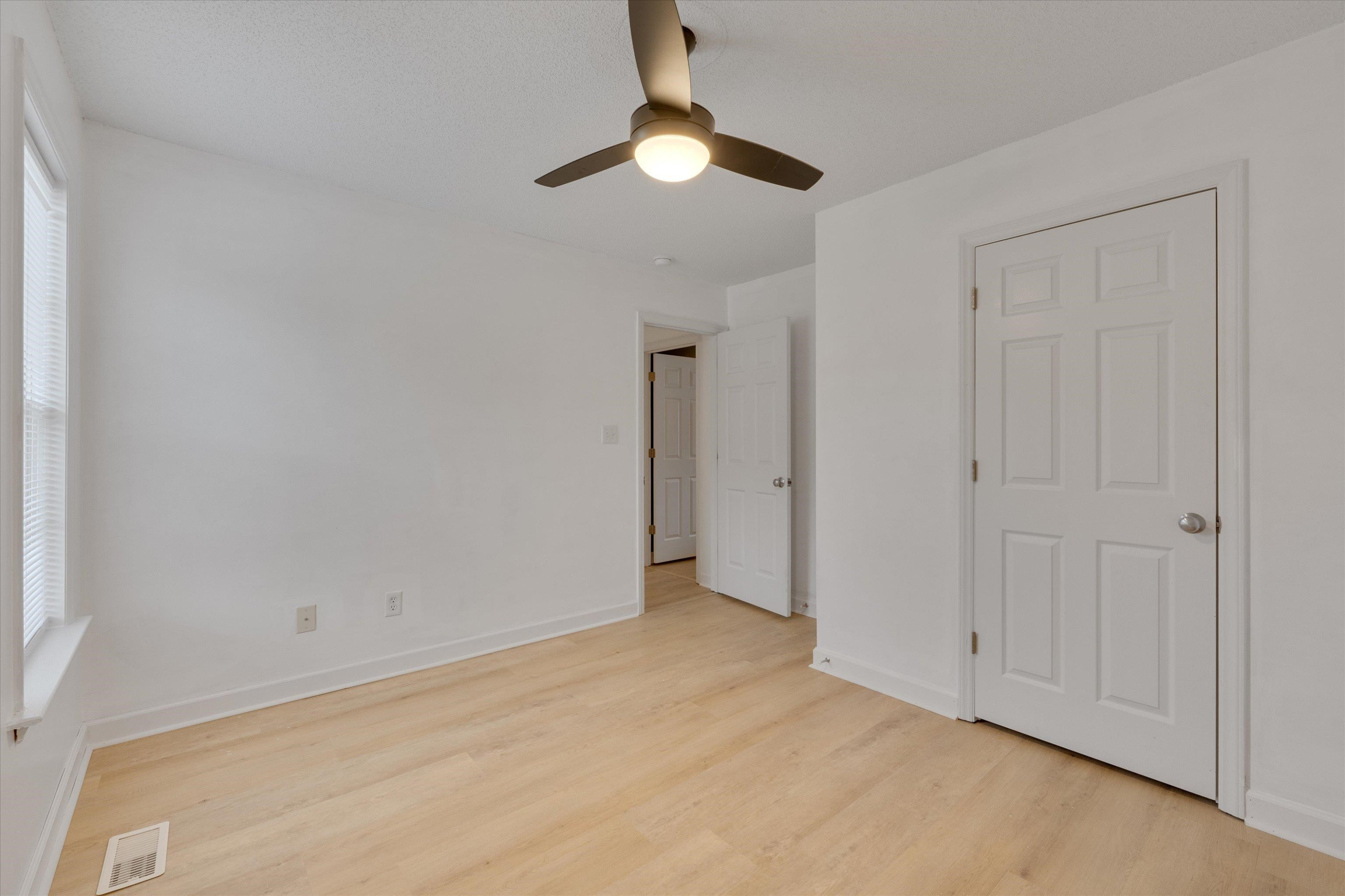 2568 Matthews Road Clayton, NC 27520 - Photo 15 of 26 a view of an empty room and chandelier fan