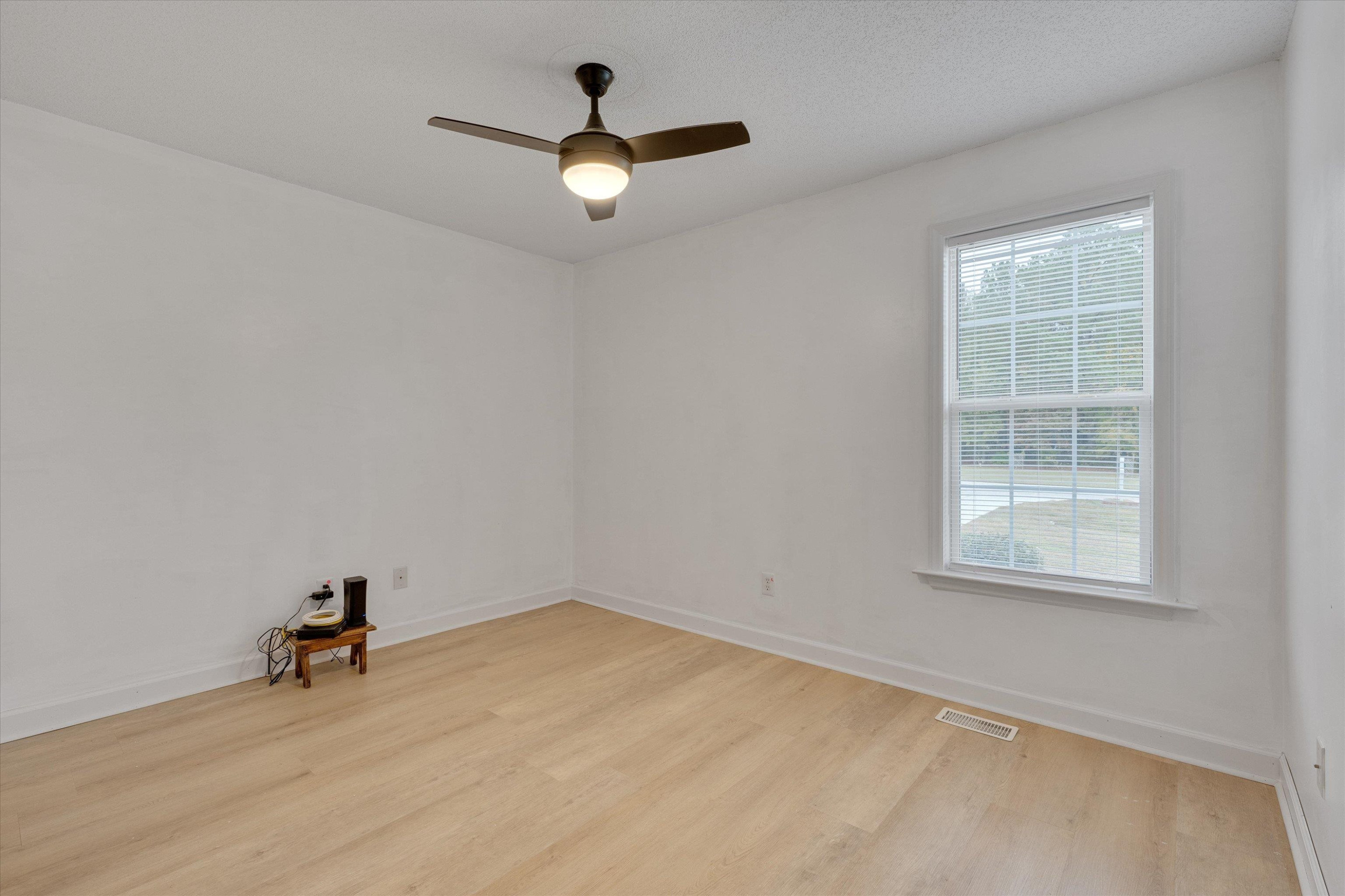 2568 Matthews Road Clayton, NC 27520 - Photo 16 of 26 an empty room with a window