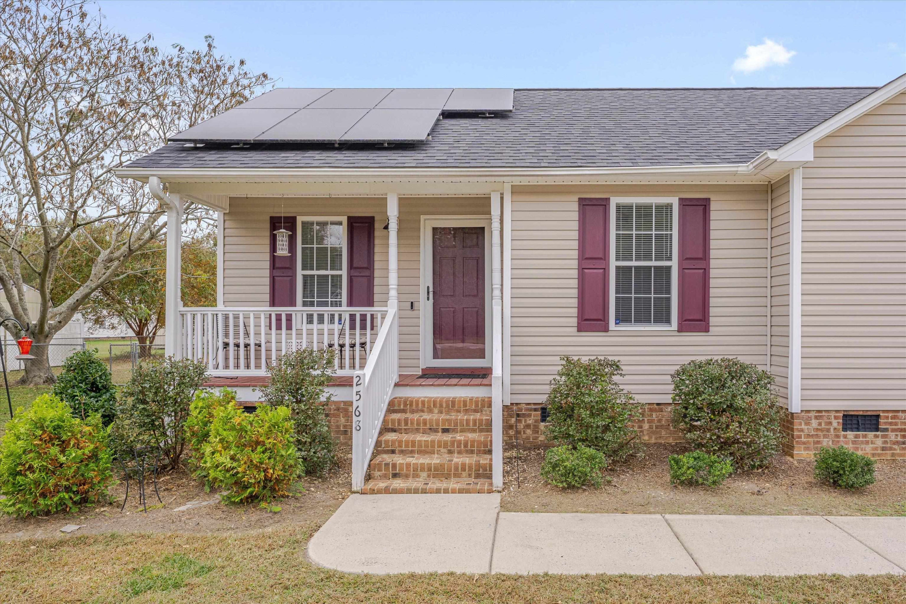 2568 Matthews Road Clayton, NC 27520 - Photo 2 of 26 a front view of a house with a yard