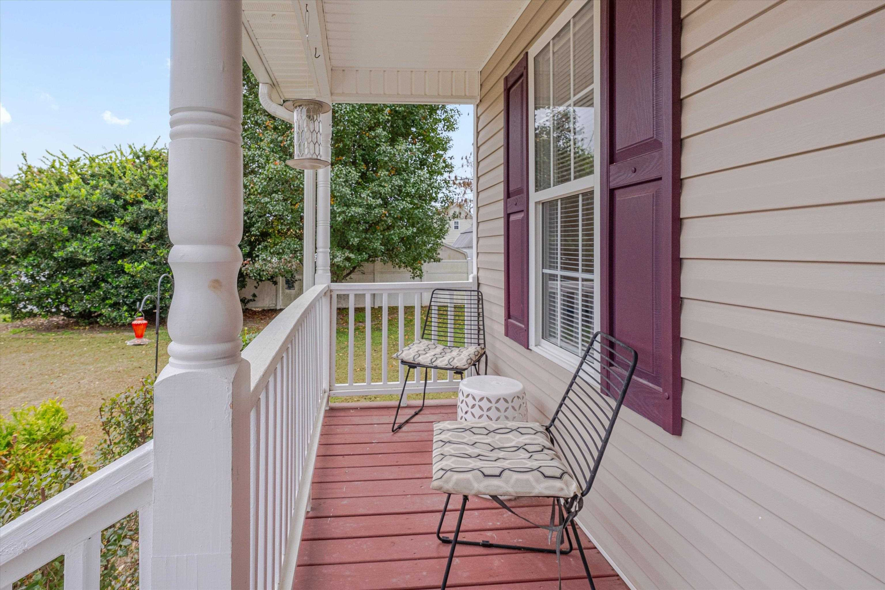2568 Matthews Road Clayton, NC 27520 - Photo 3 of 26 a view of balcony with wooden floor and outdoor seating