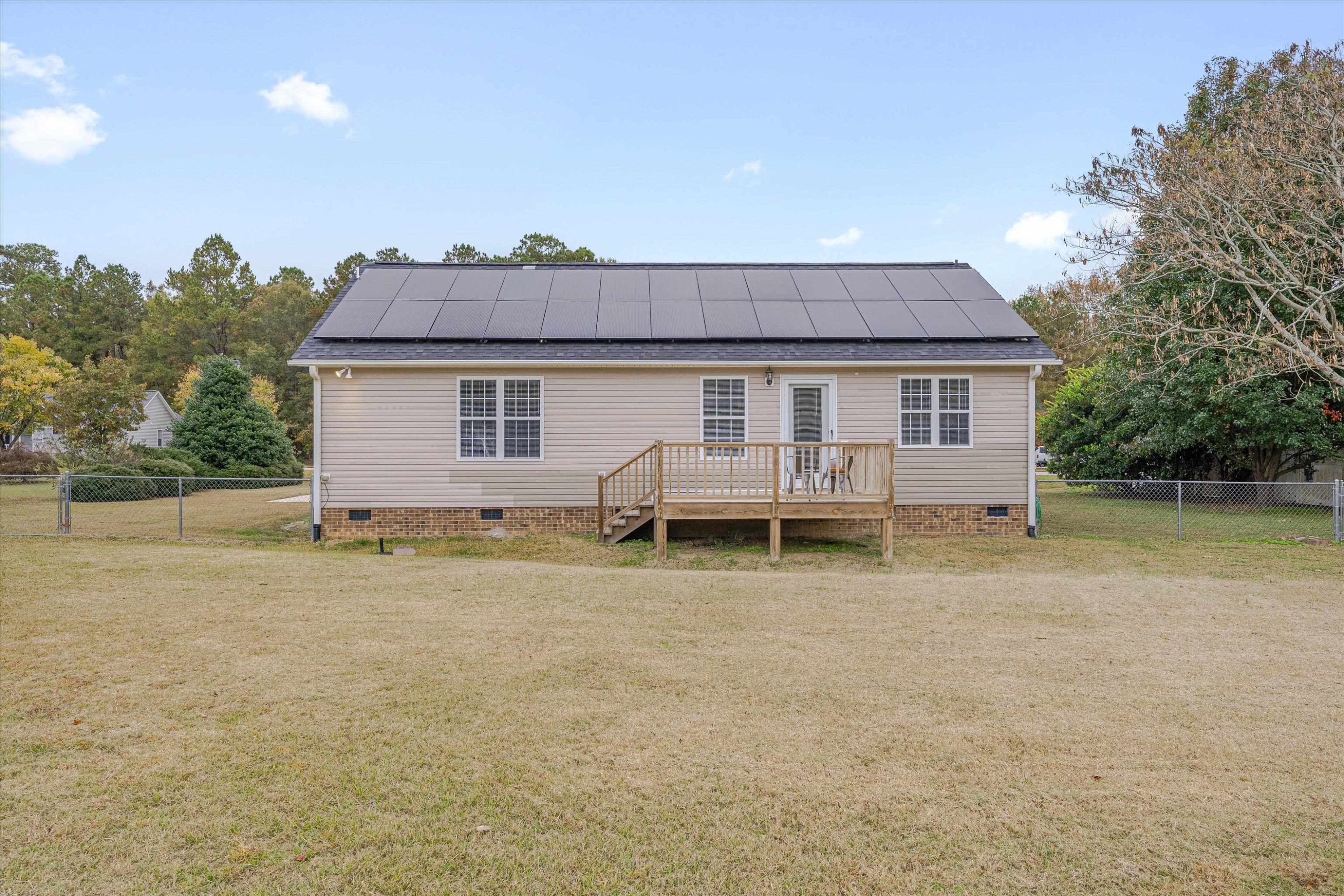 2568 Matthews Road Clayton, NC 27520 - Photo 5 of 26 a view of a house with a yard and lake view