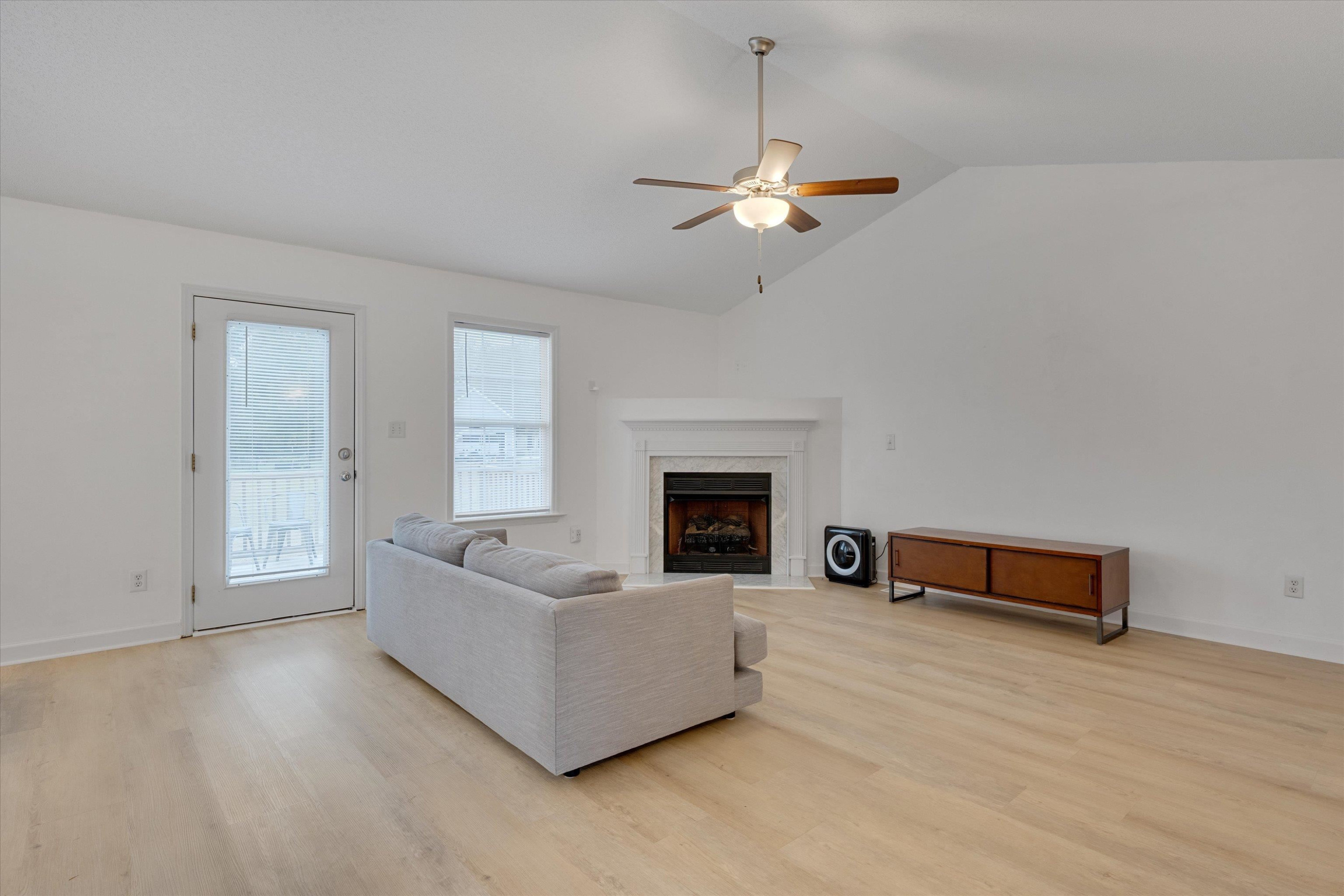 2568 Matthews Road Clayton, NC 27520 - Photo 7 of 26 a living room with furniture and a fireplace
