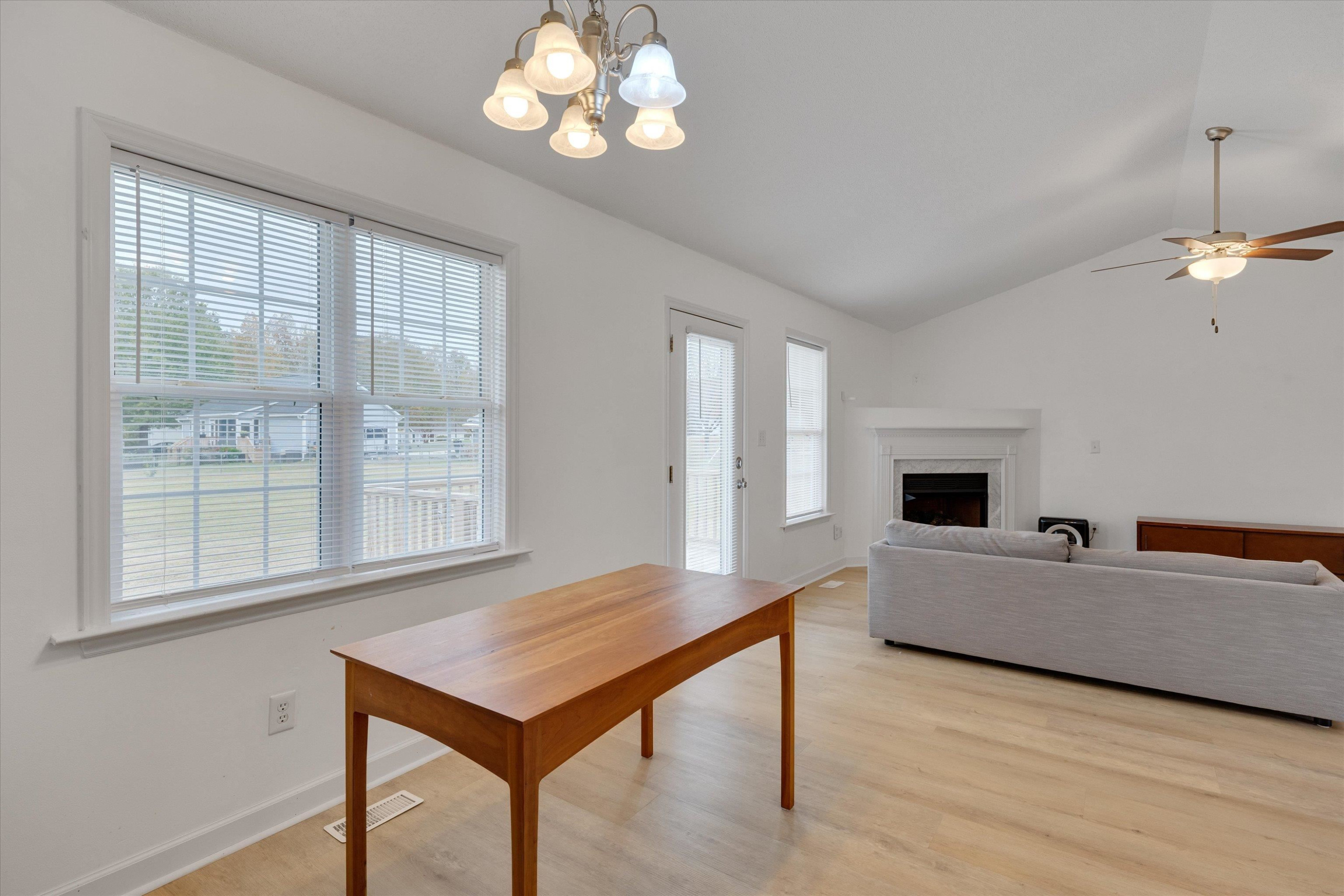 2568 Matthews Road Clayton, NC 27520 - Photo 9 of 26 a living room with furniture and a table