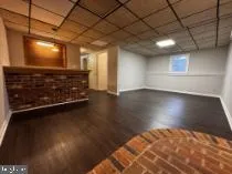 a view of room with wooden floor