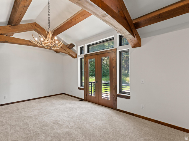 1225 Old Oregon Road Soda Springs, ID 83276 - Photo 41 of 67 Vaulted ceiling featuring exposed wood beams and a unique antler-style chandelier