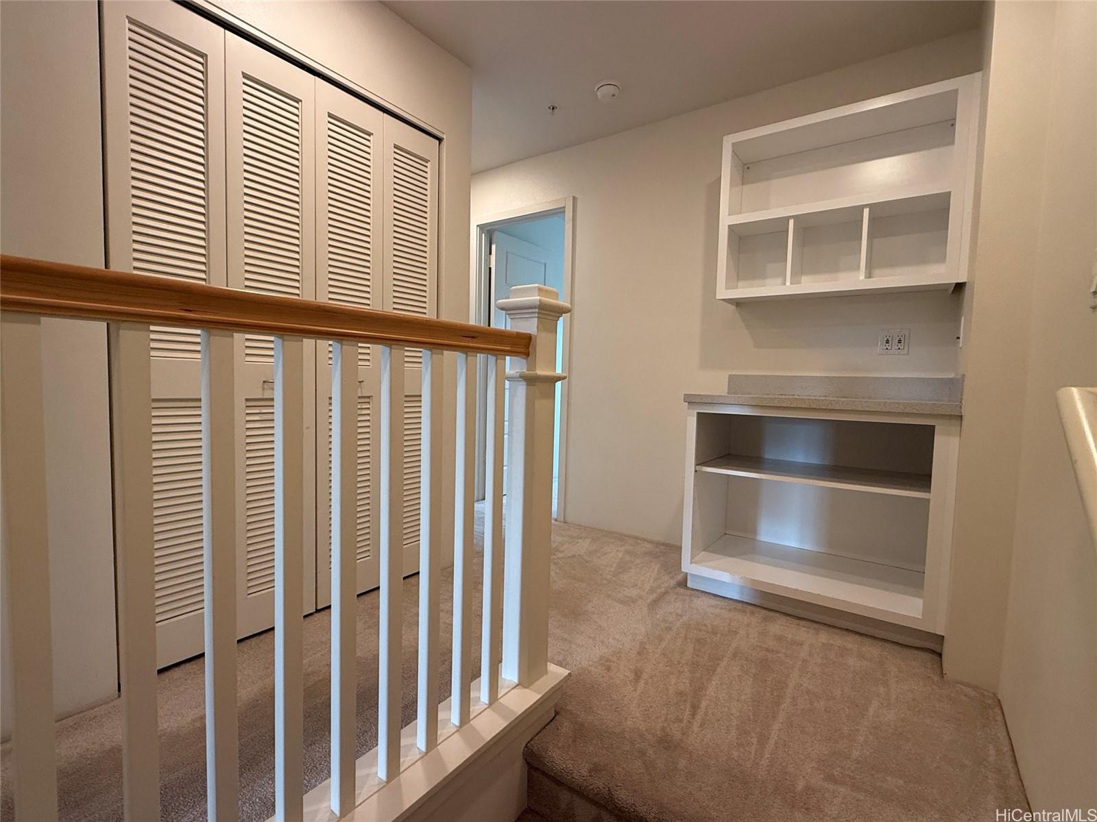 91-3524 Iwikuamo'o Street, Unit 102 Ewa Beach, HI 96706 - Photo 11 of 25 a view of a livingroom with a staircase