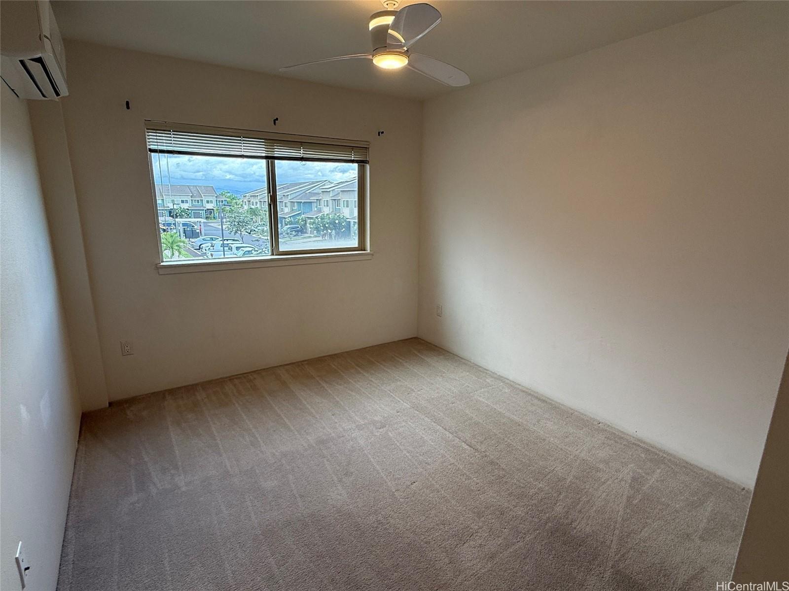 91-3524 Iwikuamo'o Street, Unit 102 Ewa Beach, HI 96706 - Photo 20 of 25 an empty room with a window