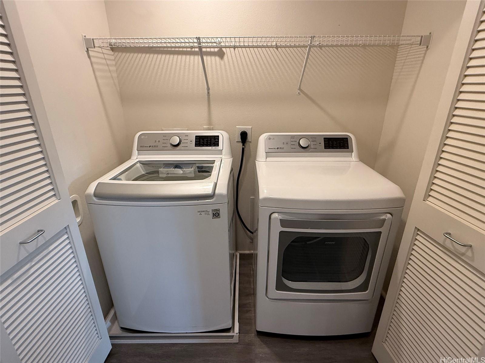91-3524 Iwikuamo'o Street, Unit 102 Ewa Beach, HI 96706 - Photo 25 of 25 a utility room with dryer and washer