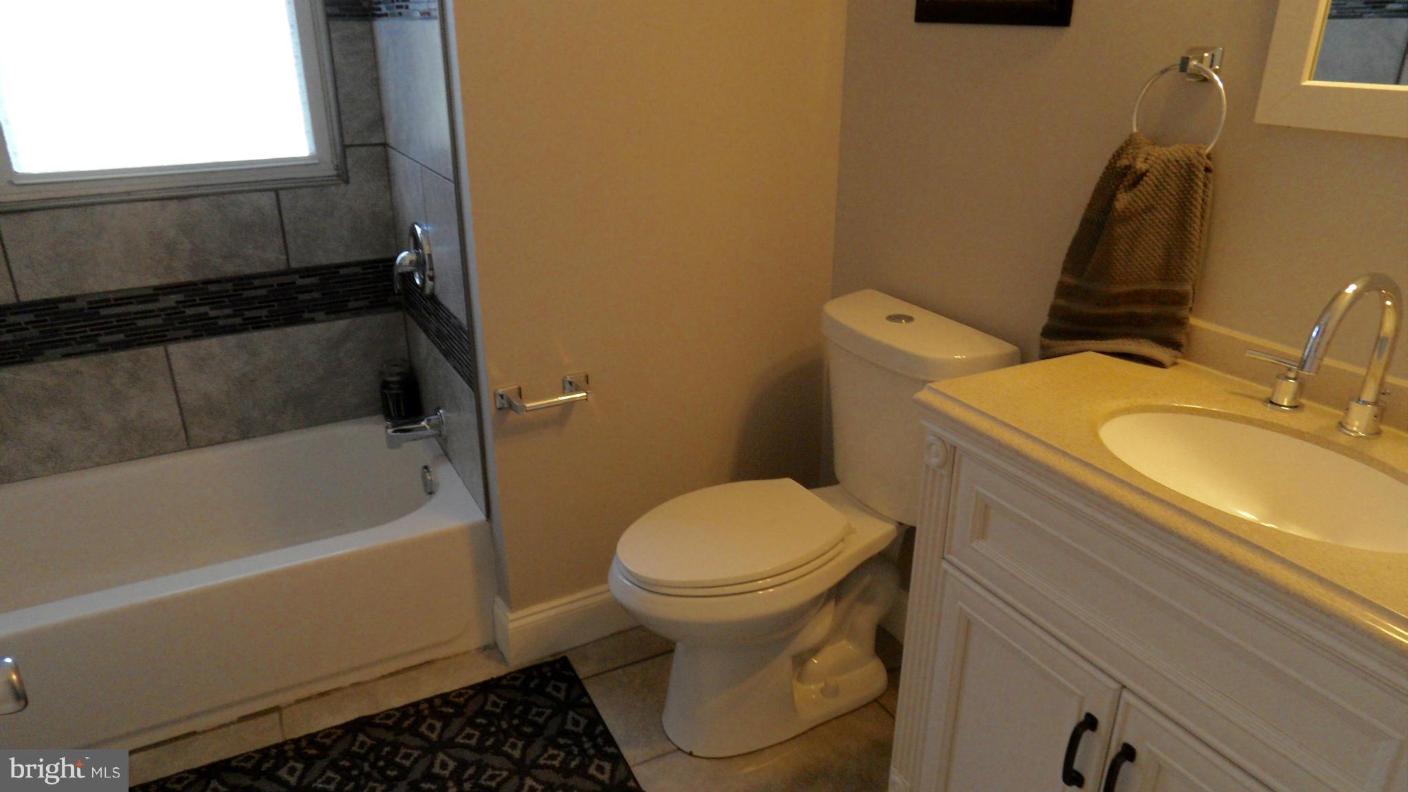 3832 Byfield Road Baltimore, MD 21207 - Photo 12 of 30 a bathroom with a sink and a toilet