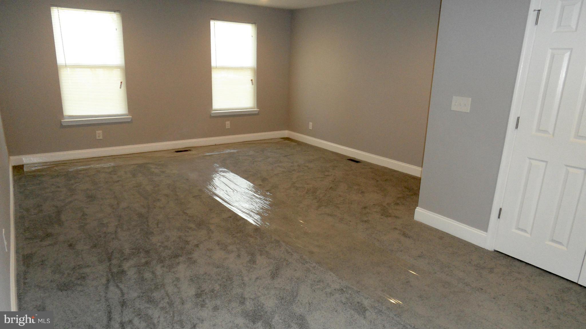 3832 Byfield Road Baltimore, MD 21207 - Photo 15 of 30 an empty room with windows